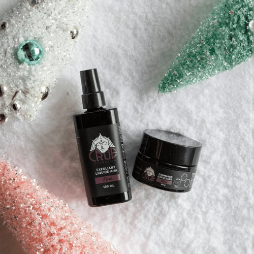 Crue cosmetics bottle and jar on a cotton surface.